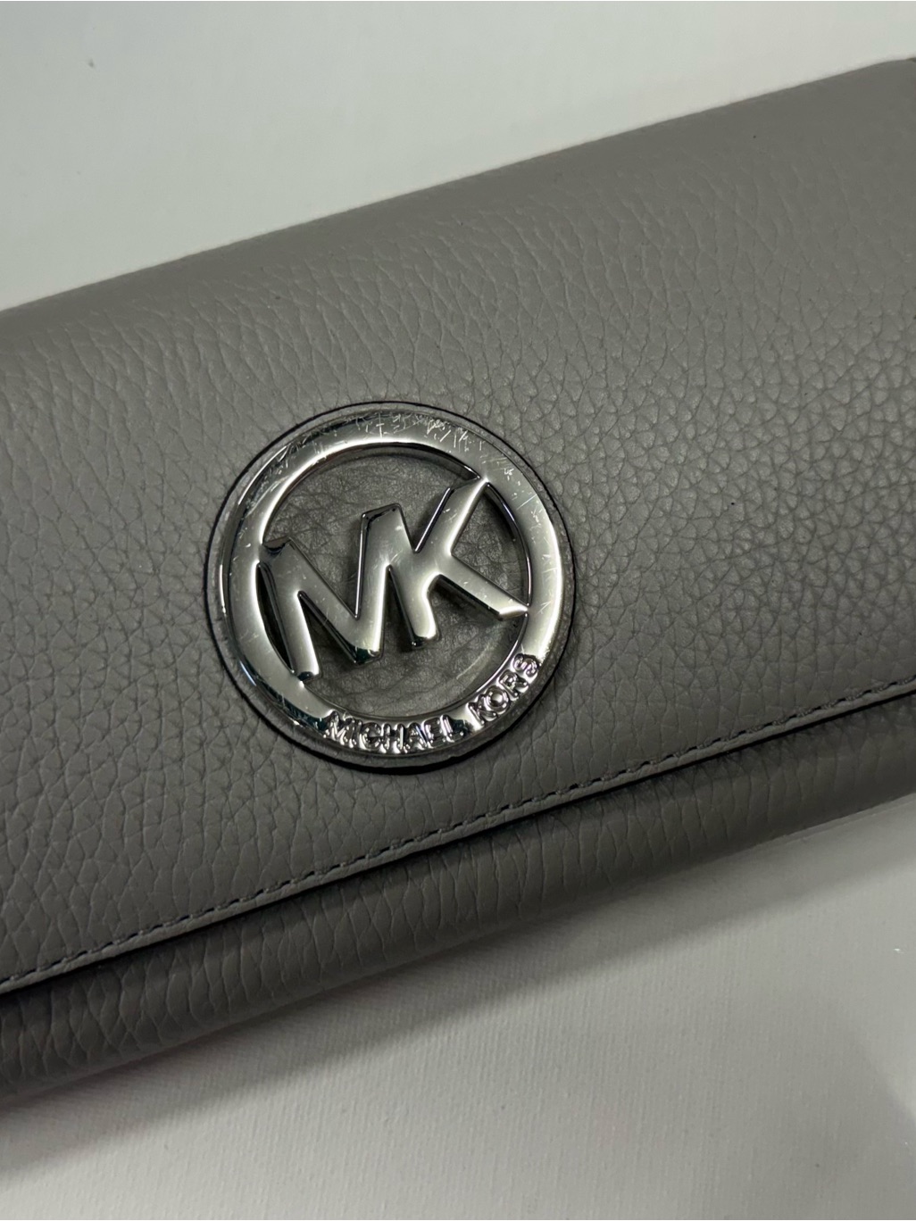 Michael Kors Gray Pebbled Leather Clutch With Silver Mk Medallion